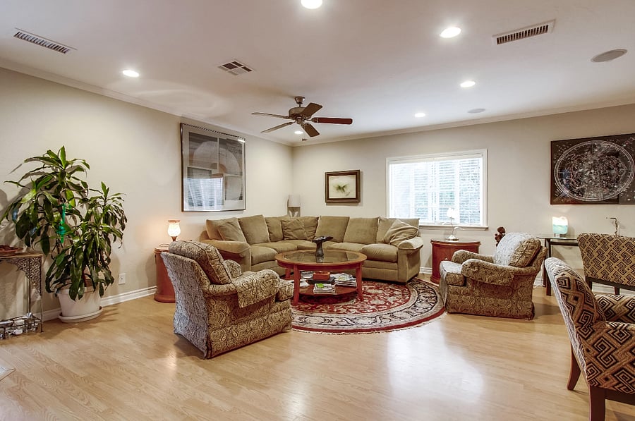 ChatGPT

The expansive living room boasts exquisite furnishings and captivating artwork, complemented by a game table and a generously-sized smart TV.