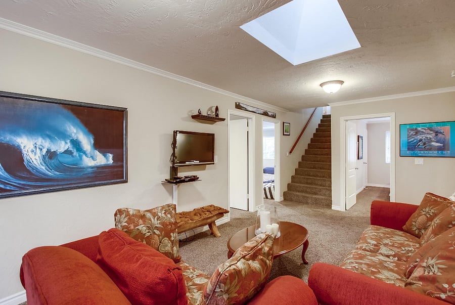 The family room is cleverly separated from the living room, dining area, and kitchen, granting your guests plenty of room to gather independently or indulge in different TV programs. Moreover, the back patio adjacent to the family room offers added privacy and ample space for relaxation.