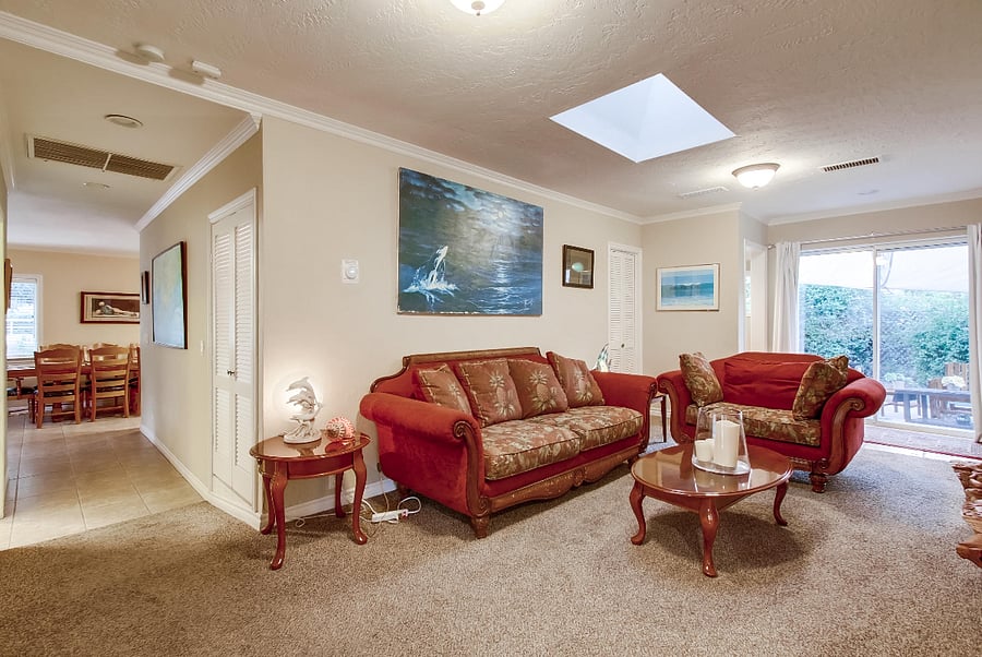 The family room is cleverly separated from the living room, dining area, and kitchen, granting your guests plenty of room to gather independently or indulge in different TV programs. Moreover, the back patio adjacent to the family room offers added privacy and ample space for relaxation.