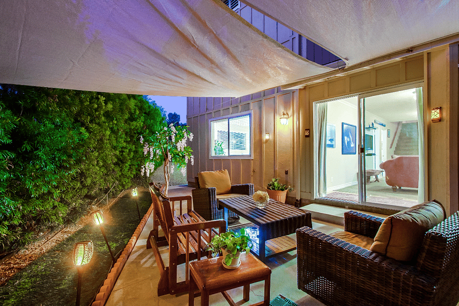 ChatGPT

The back patio, situated on the opposite side of the outdoor living space, adjoins the family room, providing both privacy and extra space for guests to gather in a distinct area.