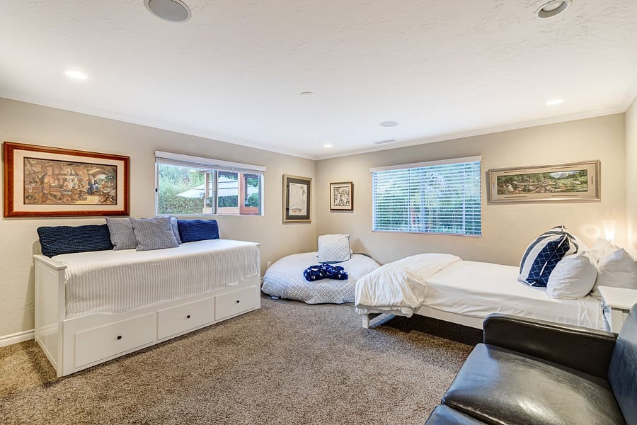 In Bedroom 3, you'll find a queen bed, a king day bed comprising three mattresses, a sofa sleeper, and an XXXL bean bag that kids absolutely love for sleeping and lounging. Additionally, there are plenty of books, games, and LEGO sets to keep children entertained for hours of indoor play.