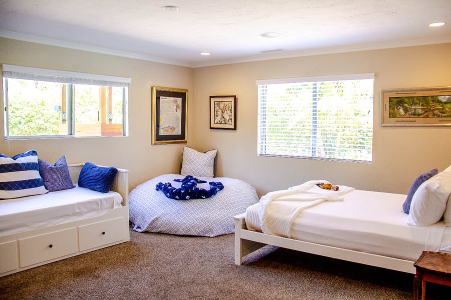 In Bedroom 3, you'll find a queen bed, a king day bed comprising three mattresses, a sofa sleeper, and an XXXL bean bag that kids absolutely love for sleeping and lounging. Additionally, there are plenty of books, games, and LEGO sets to keep children entertained for hours of indoor play.