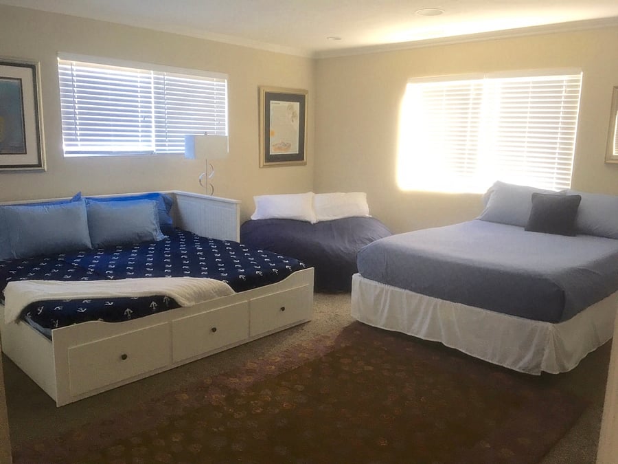 In Bedroom 3, you'll find a queen bed, a king day bed (shown as king in photo) comprising three mattresses (if you need additional bed), a sofa sleeper, and an XXXL bean bag that kids absolutely love for sleeping and lounging. Additionally, there are plenty of books, games, and LEGO sets to keep children entertained for hours of indoor play.
