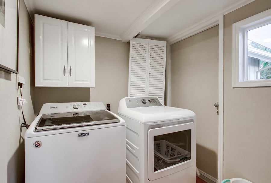 The laundry room is fully equipped with a washer and dryer, along with an iron, ironing board, and laundry soap, ensuring you have everything necessary for your laundry tasks. Additionally, the door can be closed to muffle any noise.