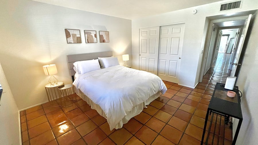Guest bedroom downstairs with queen bed