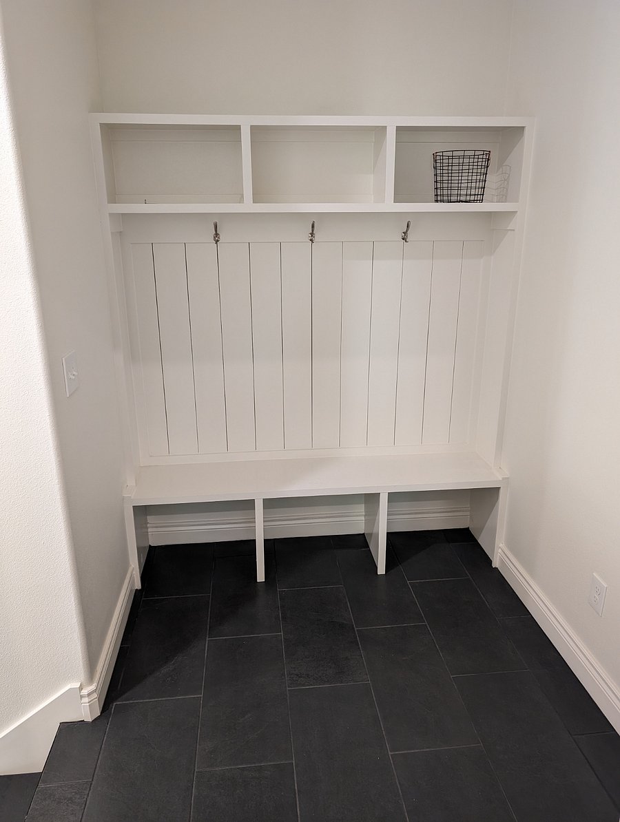 Mudroom for coat and shoe storage just outside the apartment door