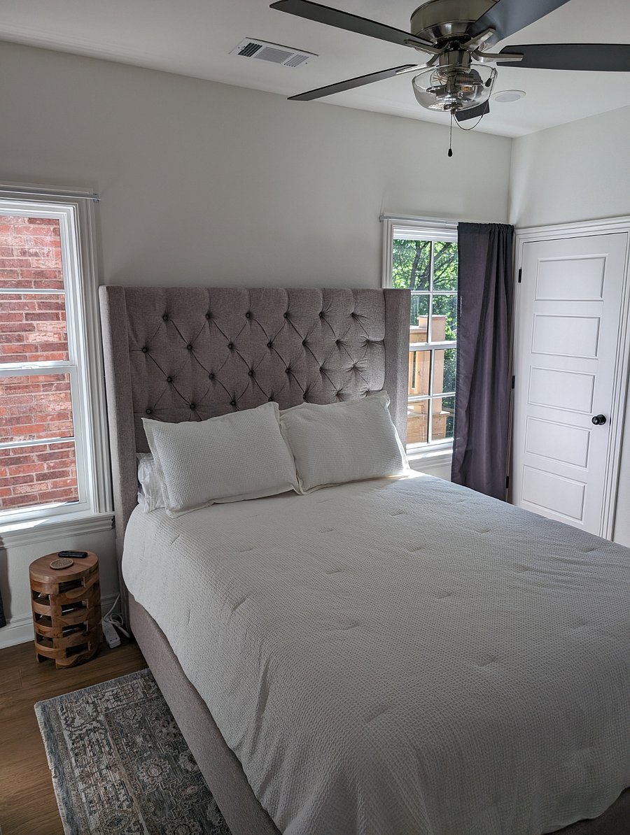 Queen size bed with two full sized closets