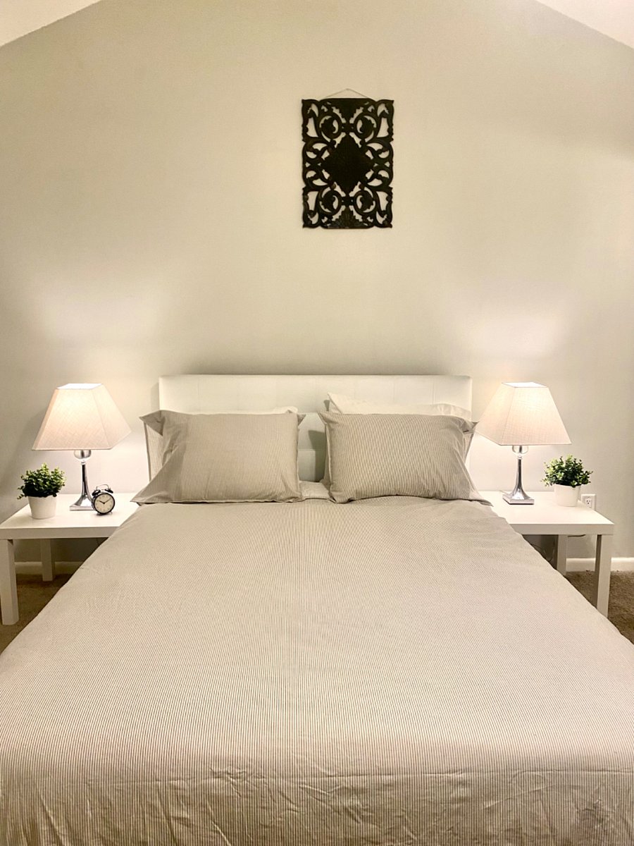 Cozy Bedroom with sliding door and lanai access, as well as a Roku Smart Tv.