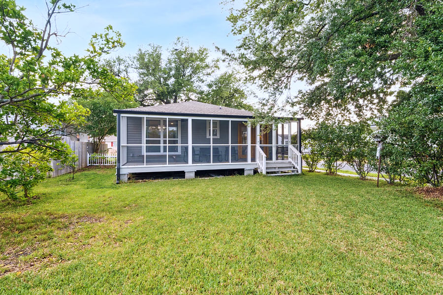 The large fenced in backyard is a beautiful retreat. The owners enjoy lots of bird sightings and picking the blood oranges off of the orange tree, pictured to the left of the home.