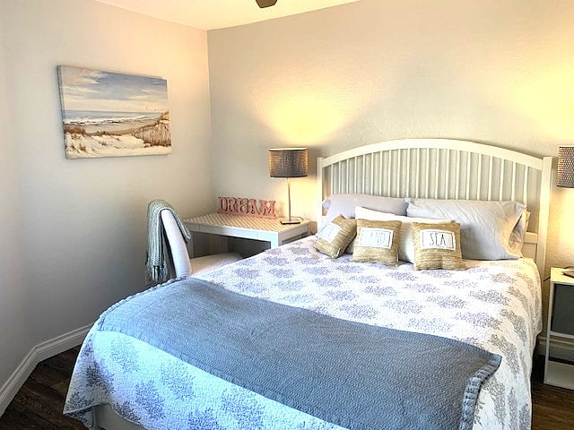 Spacious guest bedroom with desk and walk-in closet