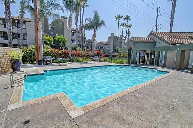 Large pool with many lounge chairs