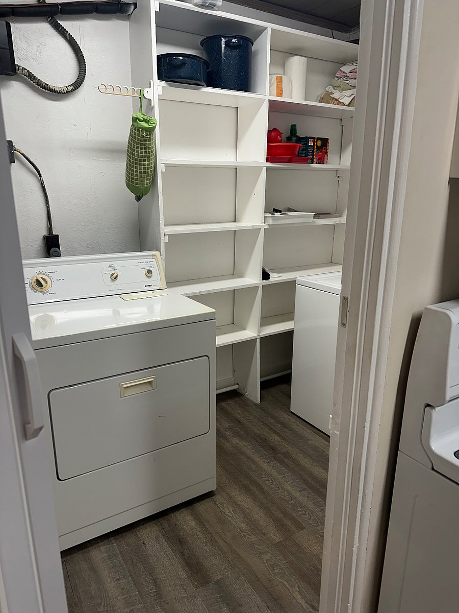 Laundry room with door off of kitchen