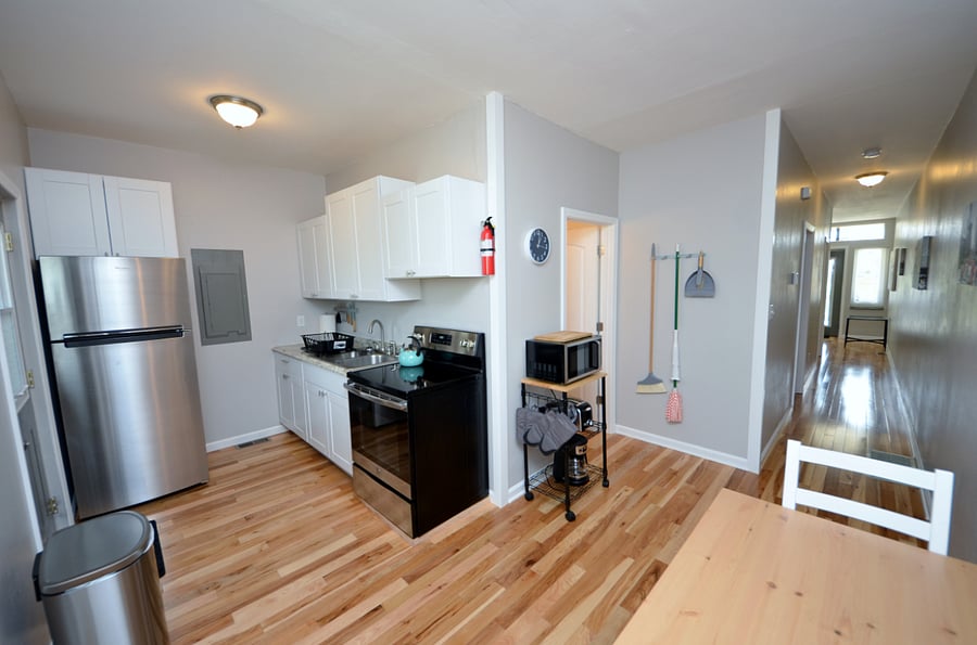 Kitchen With Full Sized Fridge, Flat Top Electric Stove, Deep Sink, Microwave & Everything You Would Need Tp Prepare A Meal
