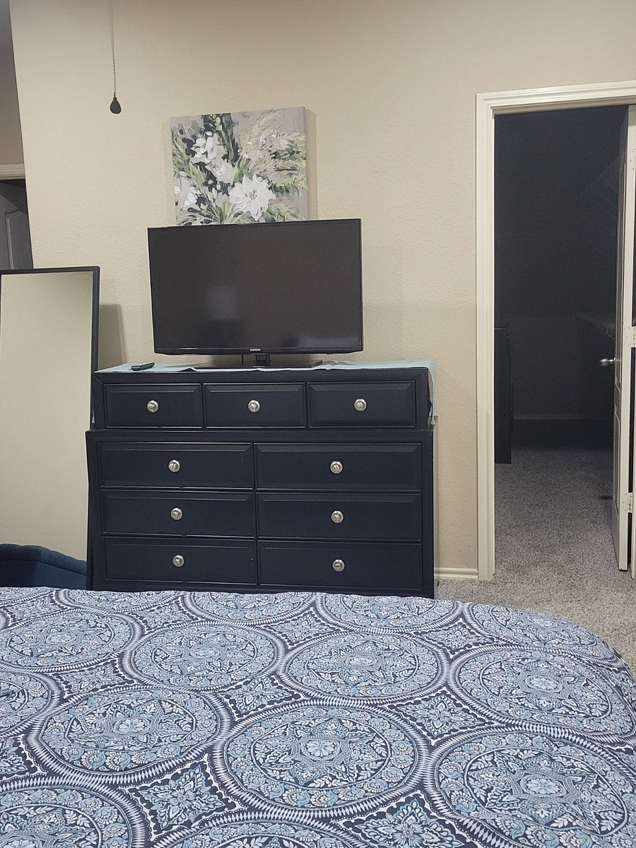 Master bedroom dresser with spacious closet space
Smart 40inch TV