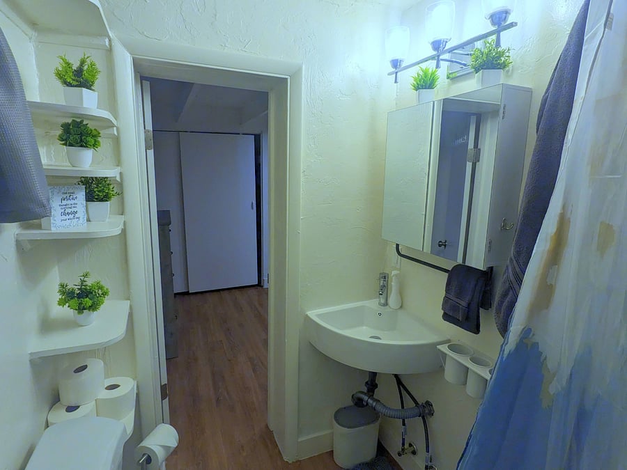Refresh and rejuvenate in the well-appointed bathroom, featuring modern fixtures and ample storage space for your toiletries.