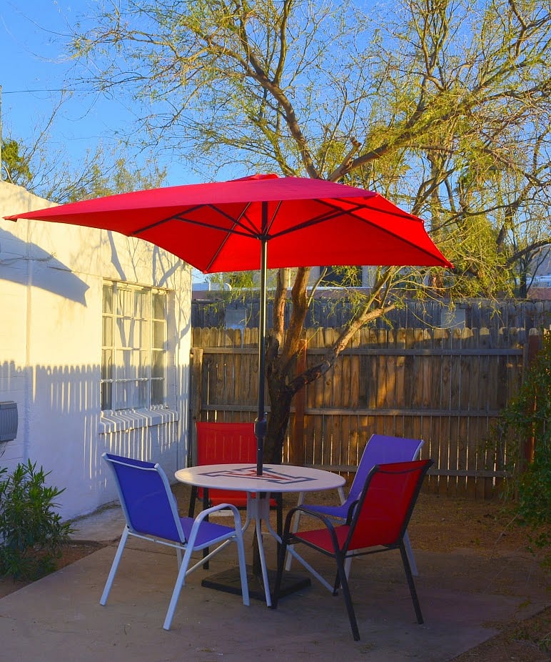 Bask in the sunshine or relax under the umbrella at the patio table.