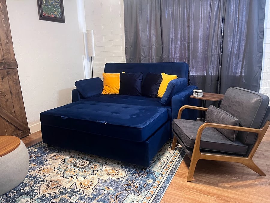 This multi-functional couch serves as a sofa, lounger and a pullout queen-size bed.
