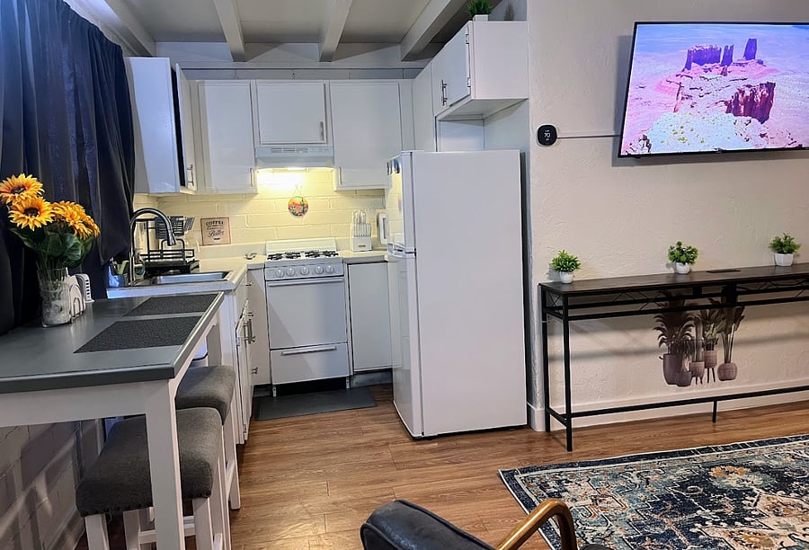 Share intimate meals at the quaint dining table, perfectly situated to enjoy the views of the yard.  Enjoy your favorite shows and movies on the Roku Smart TV, providing endless entertainment options.
