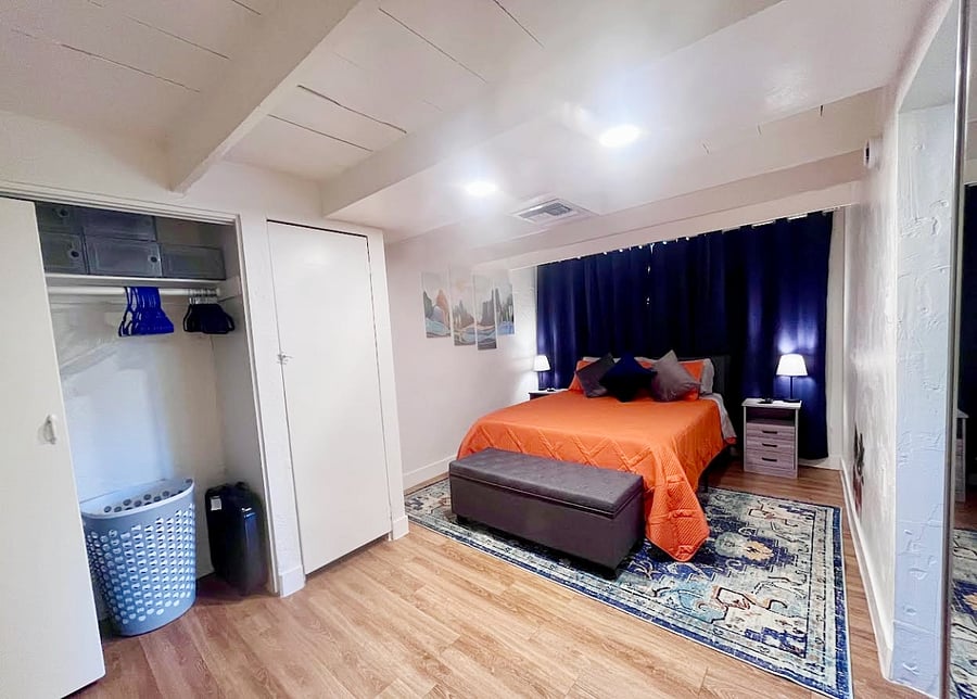 This bedroom boasts blackout curtains, ensuring uninterrupted sleep and privacy. Plus, enjoy the convenience of extra storage options, providing ample space to keep your belongings organized and out of sight.