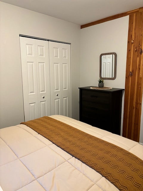 Bedroom #1
Dresser and closet with hangers, laundry basket and organizer.