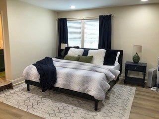 Bed room area, with new mattress, new linens and black out curtains