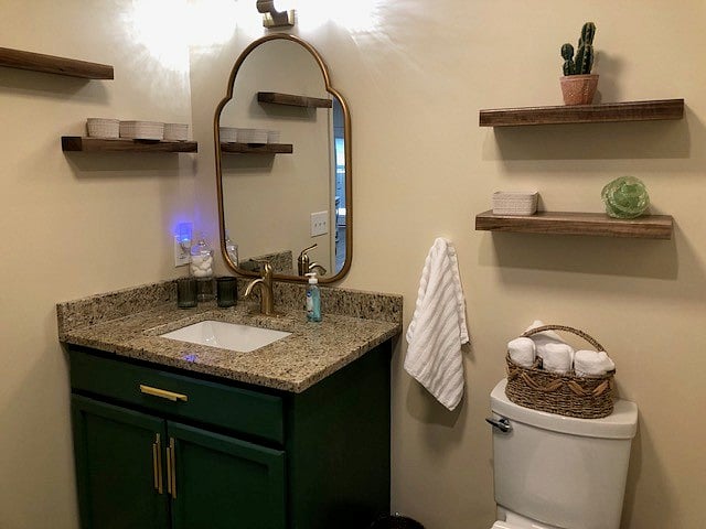 Newly built bathroom with lots of storage and beautiful lighting