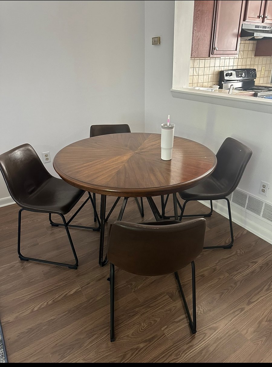 Kitchenette area dining room table with 4 chairs. 