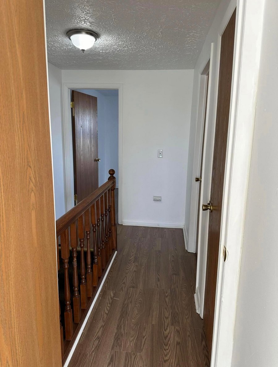 Upstairs hallway leads to each bedroom and the bathroom. 
