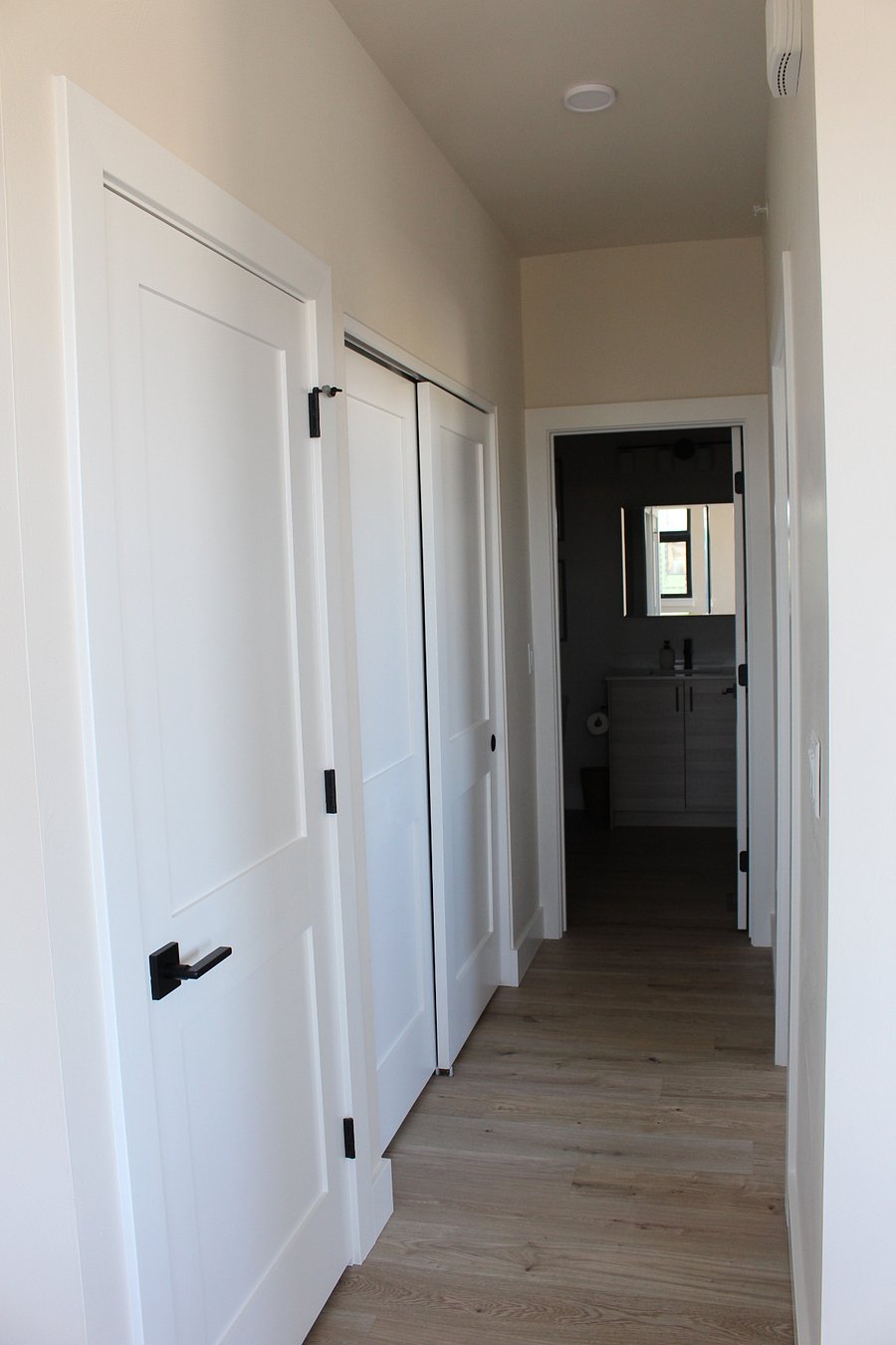 HALLWAY BETWEEN MAIN LIVING AREA HAS ADDITIONAL  CLOSET SPACE 