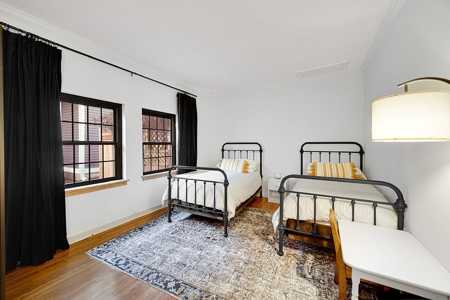 Twin bedroom down the hall from the King room. Two twin beds, stand-alone closet, shelf, room darkening curtains. 