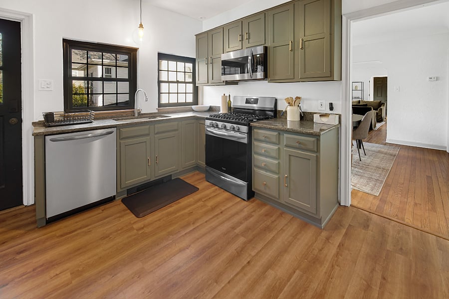 Kitchen with new appliances, granite countertops and a large sink. Fully stocked with dishes, utensils, pots/pans and cookware. 