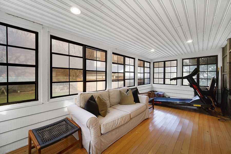 Sun room with wrap around windows, couch, table & chairs, treadmill and free weights. Beautiful spot in the mornings and evenings. 