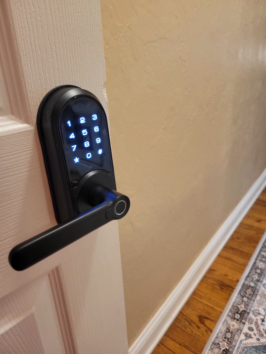 Second door to apartment at top of steps with keyless keypad lock entry.