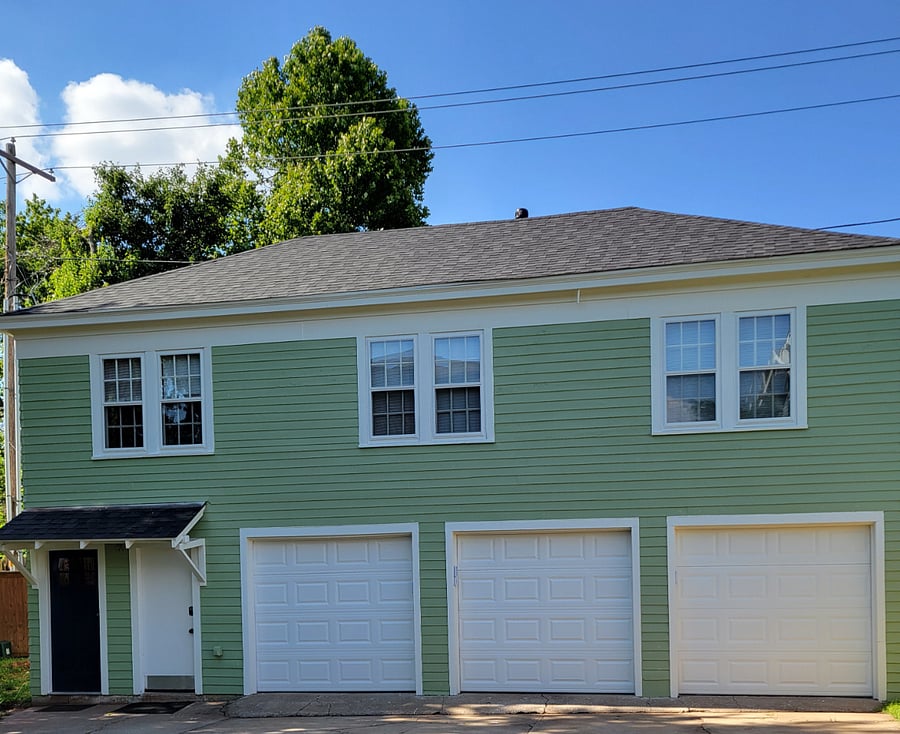Apartment is above garage which is a separate building behind our private home. It has it's own private entrance. The three windows are the apartment.