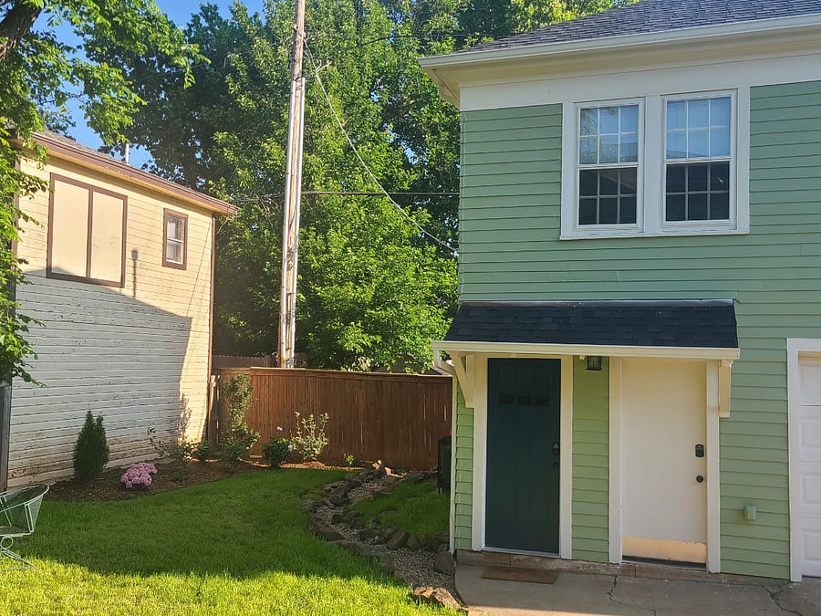 Blue door on left is private entrance to apartment. Stairs to go up to apartment.
