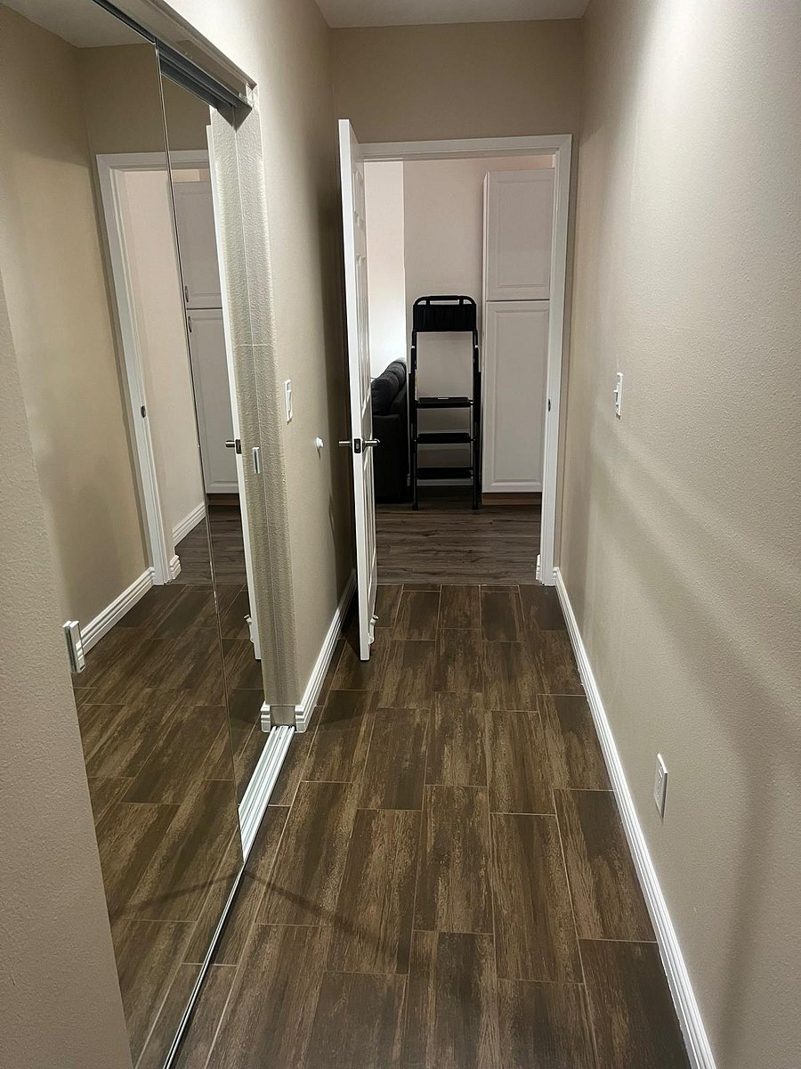Hallway from bedrooms to living room/dining/kitchen area.
