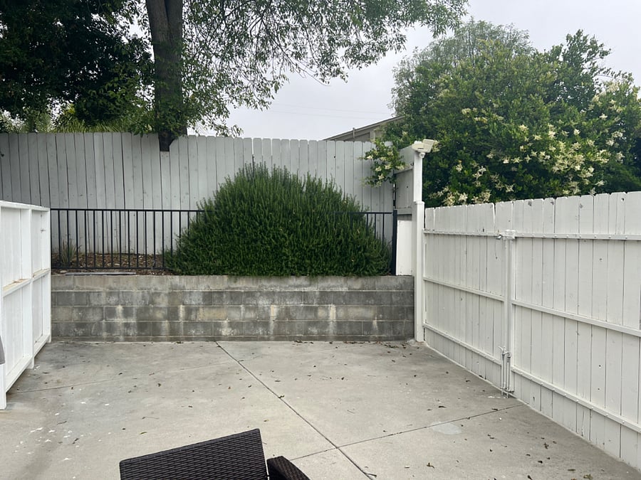 325 square feet backyard with privacy fence.