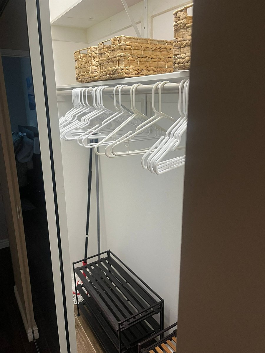 Big closet in the hallway. Shoe rack, extra storage baskets, mop, broom, tripod clothes drying rack, hangers, and dustpan set available. 