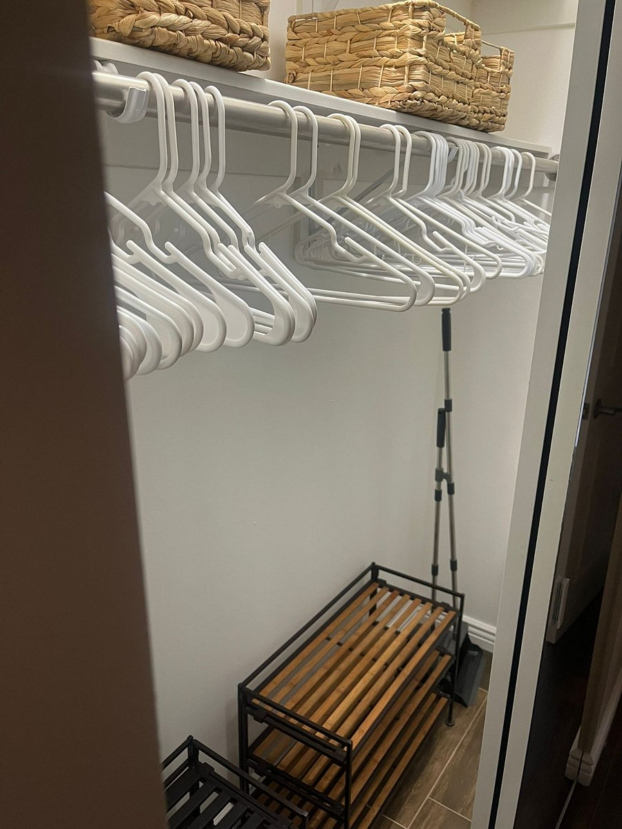 Big closet in the hallway. Shoe rack, extra storage baskets, mop, broom, tripod clothes drying rack, hangers, and dustpan set available. 