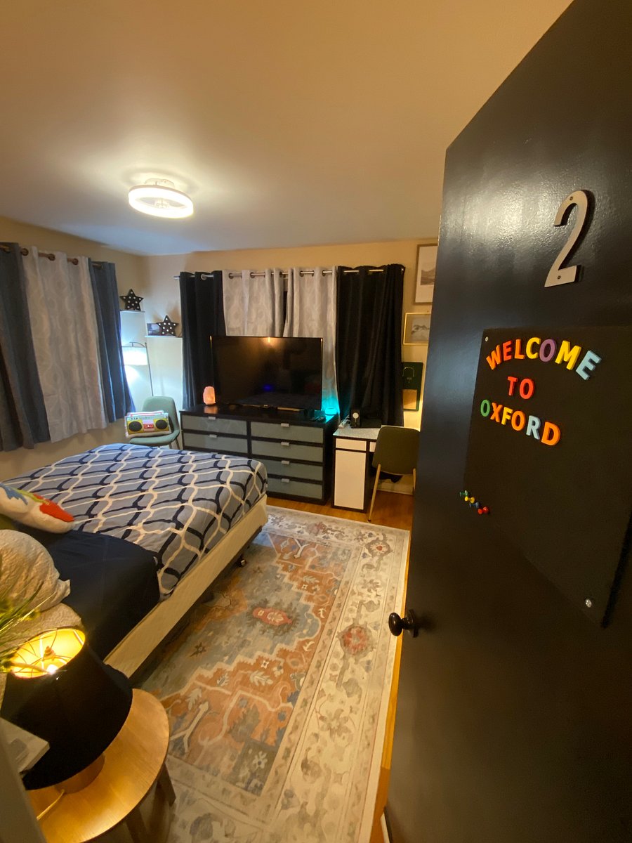 Brand-new windows fill the room with light, complemented by blackout curtains for restful sleep.