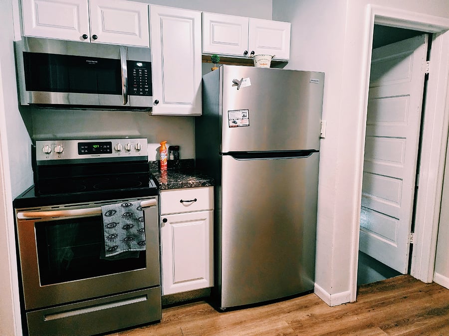 Stainless steel fridge and oven.