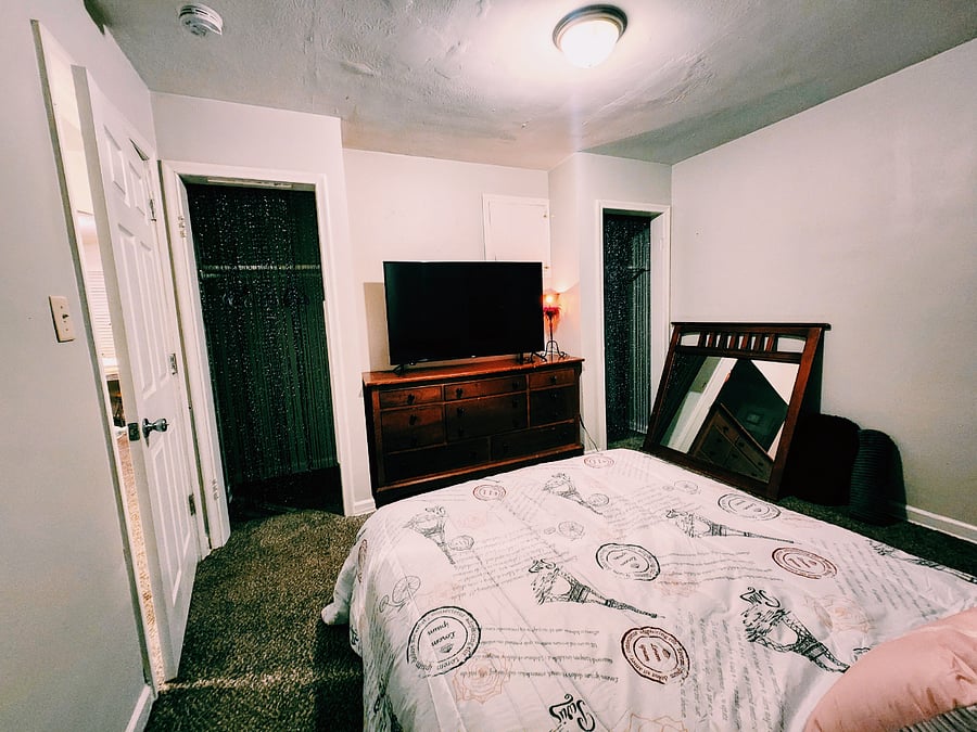 Master Bedroom with 2 closets and complimentary smart tv.