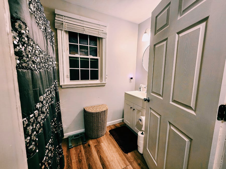 Bathroom with bathtub and filtered shower.