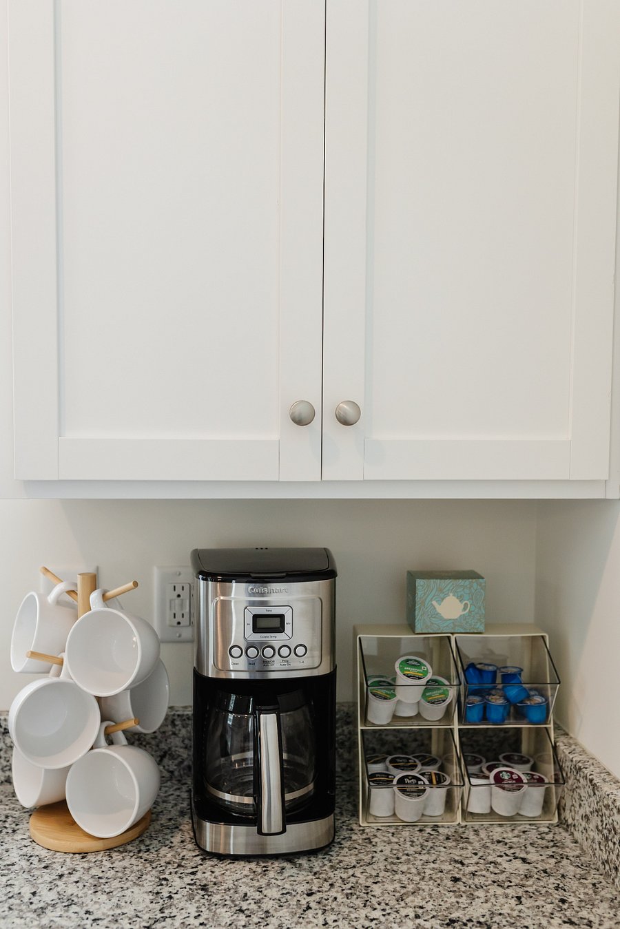 Coffee bar: mugs, coffee maker, Keurig single serve coffee maker, and k-pods