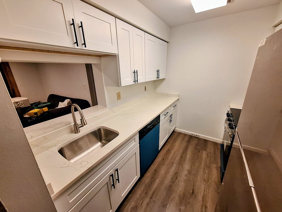 Kitchen w/ Stainless Steel Appliances & Quartz Countertops