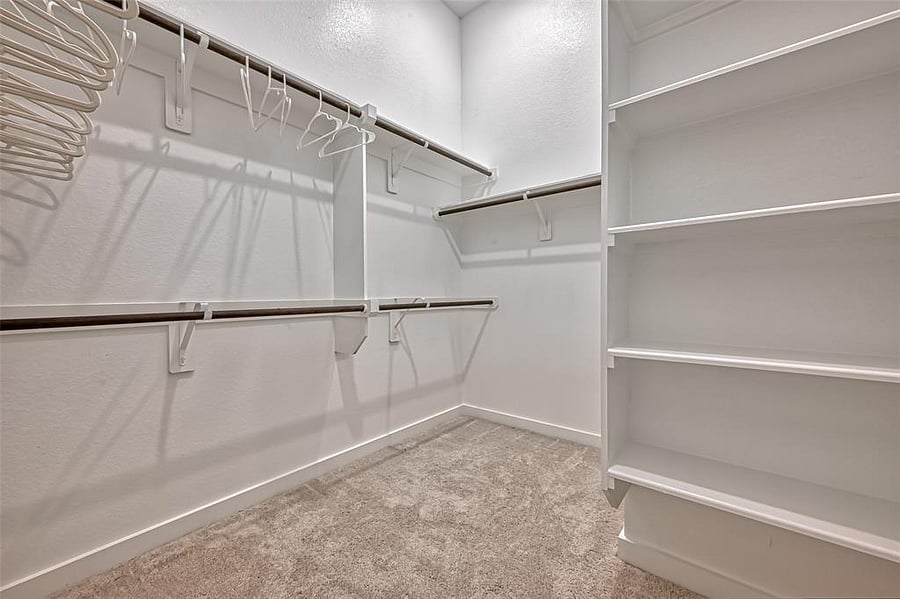 Large, walk-in primary closet