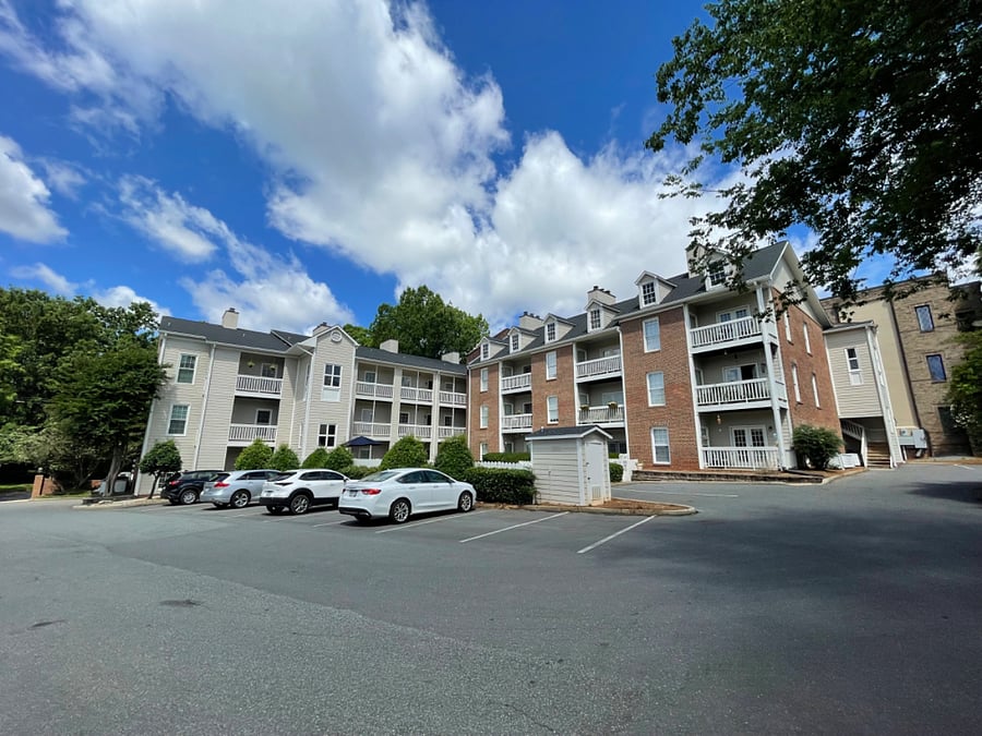 Uncovered/unassigned parking in lot adjacent to the building and pool; each unit can park 2 vehicles max at any time in the parking lot