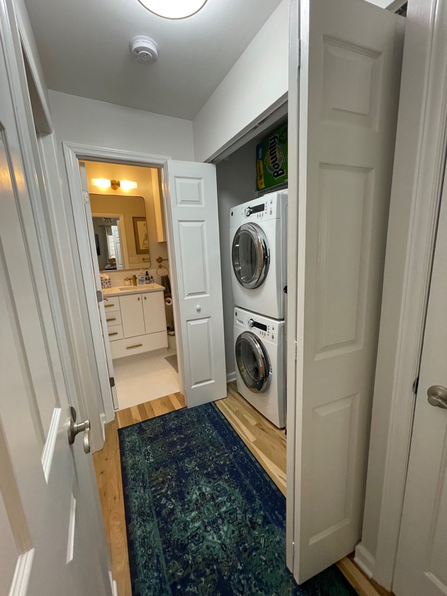 Hallway to laundry, 2nd/guest bathroom, and 2nd/guest bedroom