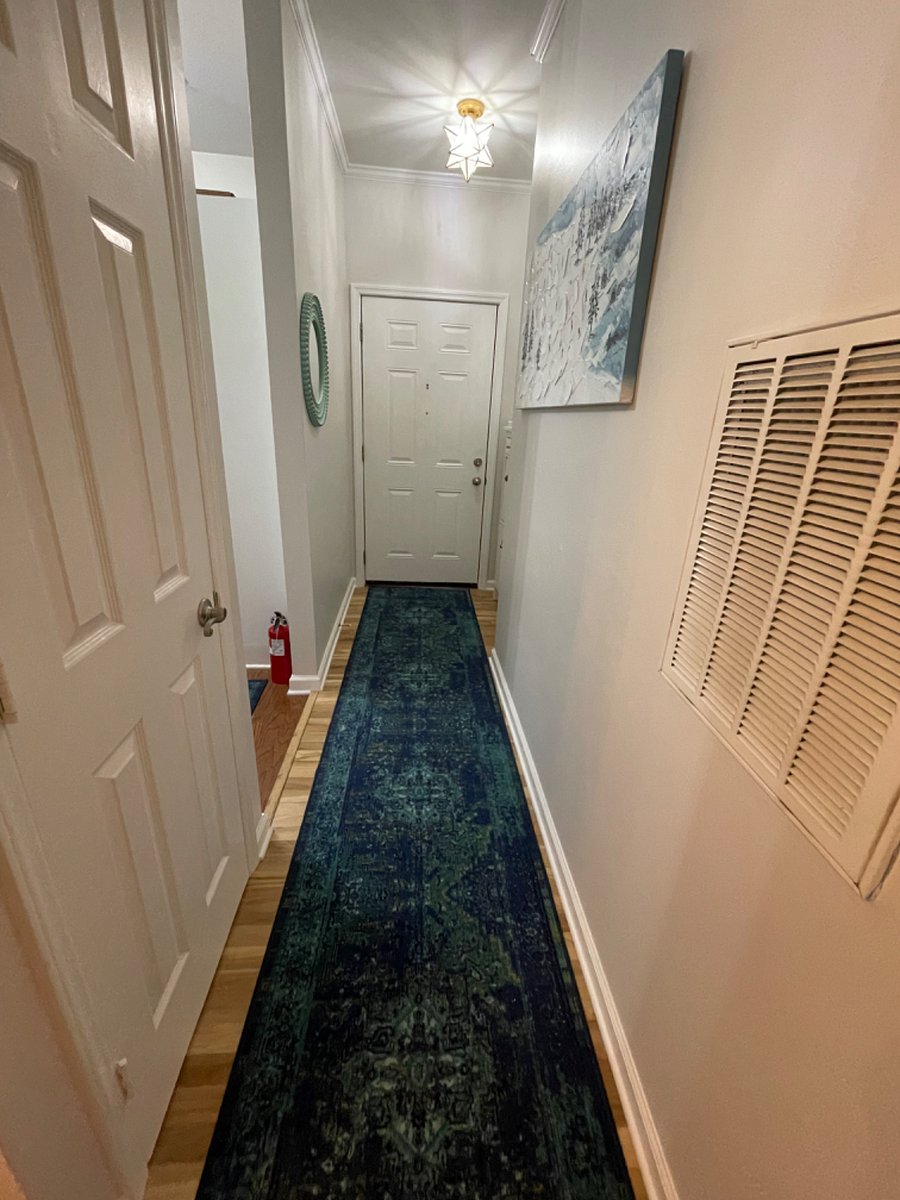 Entryway includes a shoe/umbrella storage cabinet and key hooks
