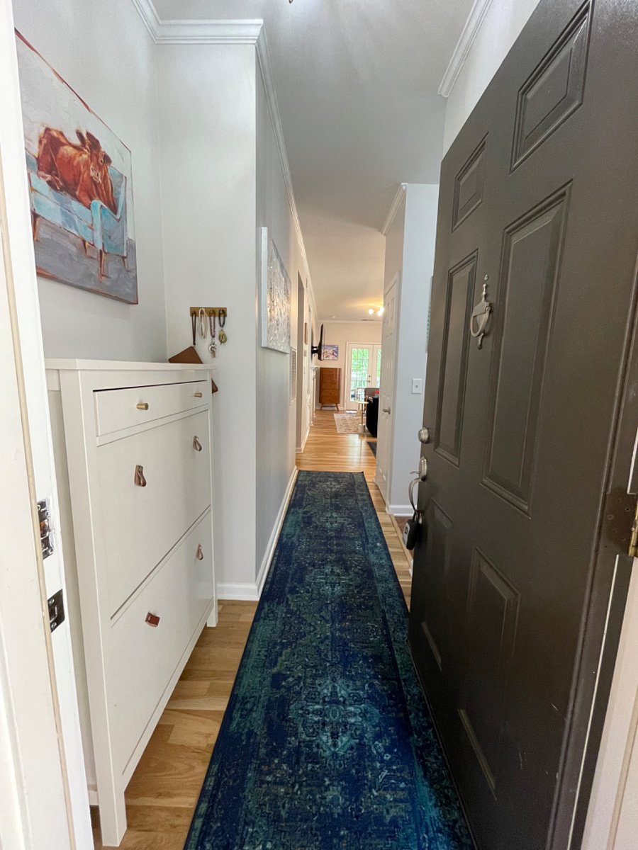 Entryway includes a shoe/umbrella storage cabinet and key hooks